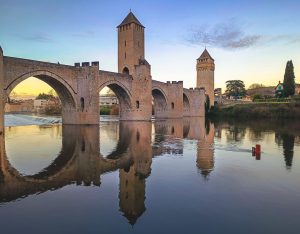 Pont Valentré, the medieval fortified bridge of Cahors, spanning the Lot River with its iconic stone towers.