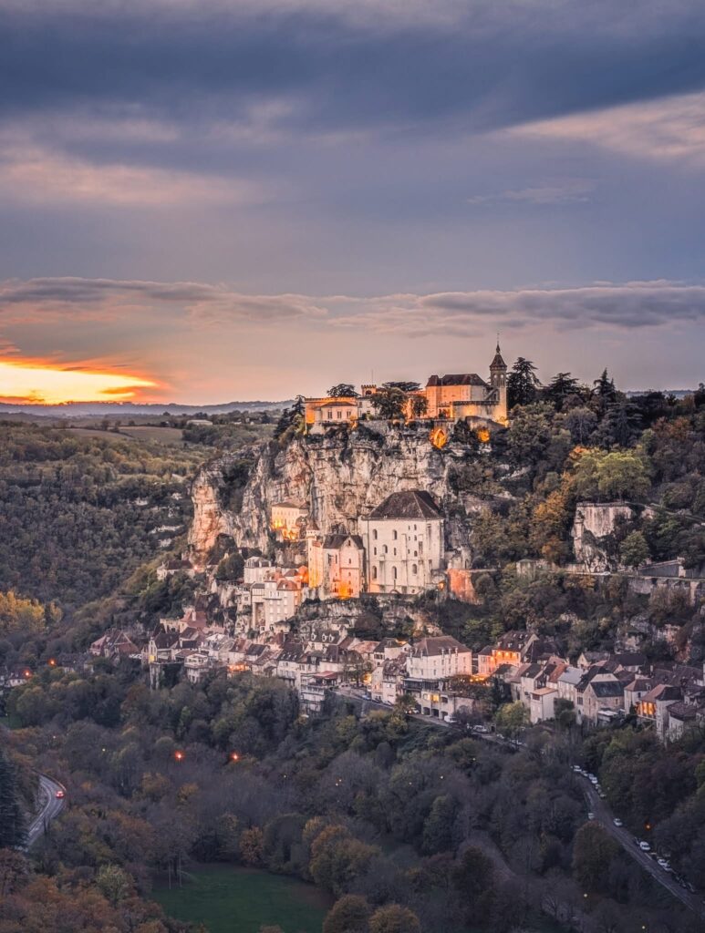 Rocamadour medieval village perched on a cliff in the Lot Valley, with stone buildings and sanctuaries overlooking the canyon.
